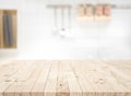 Wood table top on blur kitchen counter roombackground