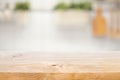 Wood table top on blur kitchen counter roombackground