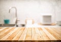 Wood table top on blur kitchen counter roombackground