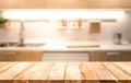 Wood table top on blur kitchen room background cooking concept