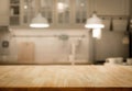 Wood table top on blur kitchen room background Royalty Free Stock Photo