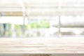Wood table top on blur kitchen window background Royalty Free Stock Photo