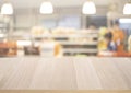 Wood table top on blur of supermarket product shelf background.business and shopping Royalty Free Stock Photo