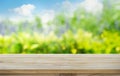 Wood table top on blur tree,garden in morning background.summer concept