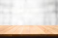 Wood table top on blur white abstract background. Royalty Free Stock Photo