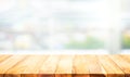 Wood table top on blur white glass wall background Royalty Free Stock Photo