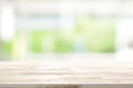 Wood table top on blur white green kitchen window background Royalty Free Stock Photo