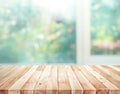 Wood table top on blur of window with garden flower background in morning.For montage product display or design key visual Royalty Free Stock Photo