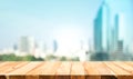 Wood table top on blur window glass,wall background with city view.For montage product display or design key visual Royalty Free Stock Photo
