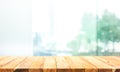 Wood table top on blur window glass,wall background with city view.For montage product display or design key visual Royalty Free Stock Photo