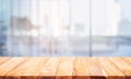 Wood table top on blur window glass,wall background with city view.For montage product display or design key visual Royalty Free Stock Photo