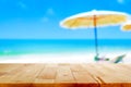 Wood table top on blurred beach background Royalty Free Stock Photo