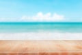 Wood table top on blurred blue sea and white sand beach background - can be used for display or montage your products Royalty Free Stock Photo