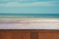 Wood table top on blurred blue sea Royalty Free Stock Photo