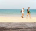 Wood table top on blurred blue sea and white sand beach Royalty Free Stock Photo