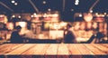 Wood table top on blurred of cafe restaurant with light gold Royalty Free Stock Photo