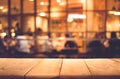 Wood table top on blurred of cafe restaurant with light gold Royalty Free Stock Photo