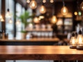 Wood table top on blurred of counter cafe shop with light bulb Background Royalty Free Stock Photo