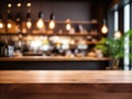 Wood table top on blurred of counter cafe shop with light bulb Background Royalty Free Stock Photo