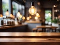 Wood table top on blurred of counter cafe shop with light bulb Background Royalty Free Stock Photo