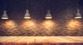 Wood table top on blurred of counter cafe shop with light bulb Royalty Free Stock Photo