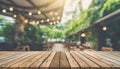 Wood table top on blurred interior blurred people meeting in coffee shop cafe co-working space Ready used us display or montage