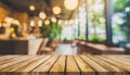 Wood table top on blurred interior blurred people meeting in coffee shop cafe co-working space Ready used us display or montage