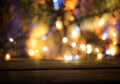 Wood table top with blurred light gold blue bokeh abstract christmas background Royalty Free Stock Photo