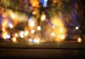 Wood table top with blurred light gold blue bokeh abstract christmas background Royalty Free Stock Photo