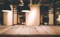 Wood table top on blurred of room interior with light bulb Royalty Free Stock Photo