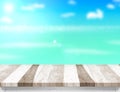 Wood table top with blurred sea,sun and beach at background, Mock up template for display or montage of your product, Summer Royalty Free Stock Photo