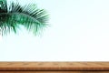 Wood table top on blurred of sky blue background with coconut leaf. Sky cloud clear Royalty Free Stock Photo