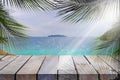 Wood table top and blurred summer beach and sky background, can used for display or montage Royalty Free Stock Photo