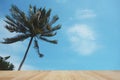 Wood table top on coconut tree and blue sky background. Royalty Free Stock Photo