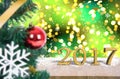 Wood table top 2017 on gold bokeh christmas tree background Royalty Free Stock Photo