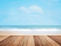 Wood table top over summer beach and blue sky Royalty Free Stock Photo
