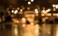 Wood table top with reflect on blur of lighting in cafe,restaurant Royalty Free Stock Photo