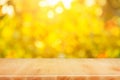 Wood table top on shiny bokeh gold background - can be used for Royalty Free Stock Photo