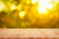 Wood table top on shiny bokeh gold background - can be used for Royalty Free Stock Photo