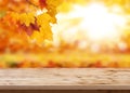 Wood table top on shiny bokeh gold background - can be used for display or montage your products Royalty Free Stock Photo