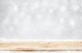 Wood table top with snowfall of winter season background.christmas Royalty Free Stock Photo