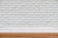 Wood table top on white brick wall background Royalty Free Stock Photo