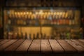 Wood table with a view of blurred beverages bar backdrop Royalty Free Stock Photo