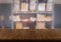 Wood table in warehouse storage blur background