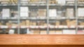 Wood table in warehouse storage blur background