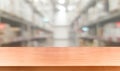 Wood table in warehouse storage blur background