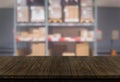 Wood table in warehouse storage blur background. Royalty Free Stock Photo