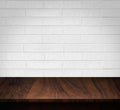 Wood table with White brick wall background Royalty Free Stock Photo