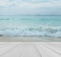 Wood Terrace on The Beach with Clear Sky, Crystal Clean and Clear Sea and Big Waves Coming to Jetty Scenery Background for Mock up