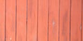 Wood texture background panorama painted coral red salmon colored